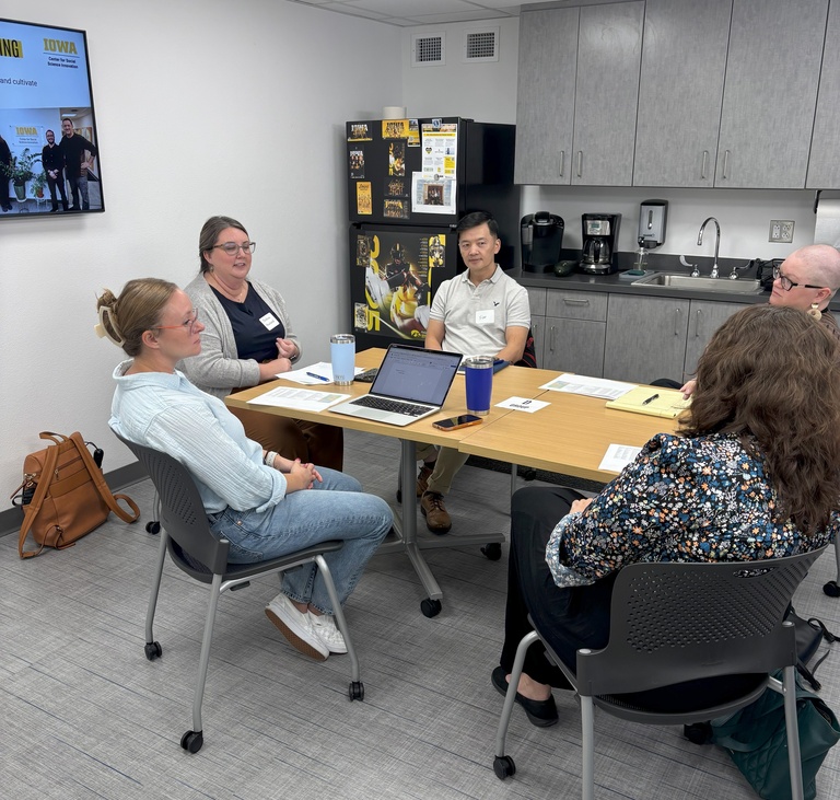 Faculty discussing research ideas